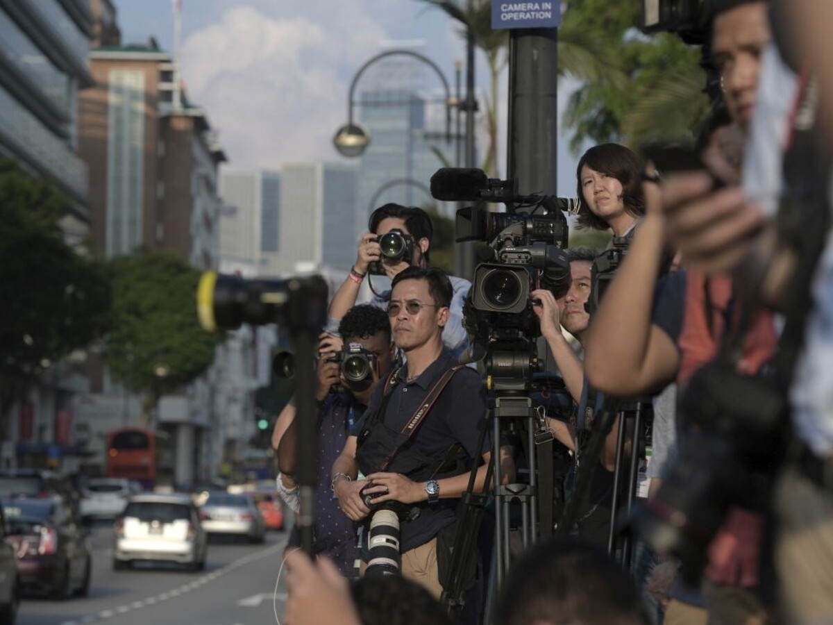 Singapur Trump Kim summit novinári 1140 px (SITA/AP)