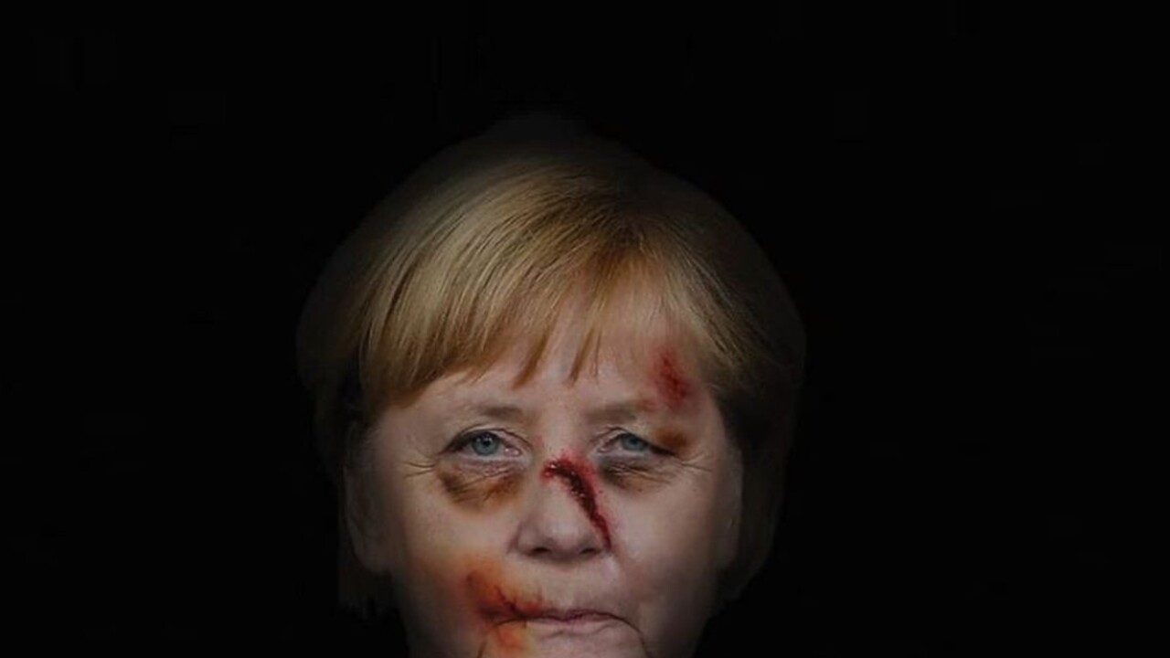 Na uliciach sa objavili fotografie dobitej Merkelovej i Clintonovej