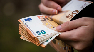 closeup-female-hands-counting-euro-banknotes-world-money-inflation-economy-concept.jpg