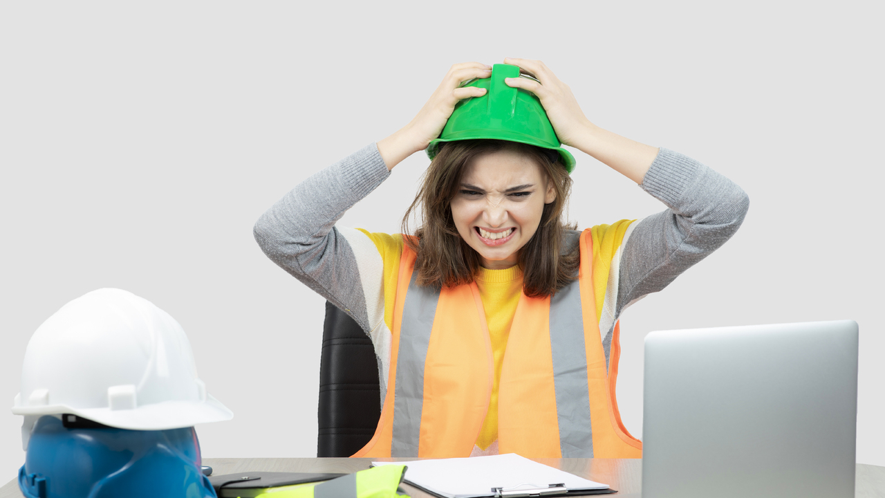 worker-female-uniform-sitting-desk-with-laptop-clipboard-high-quality-photo.jpg